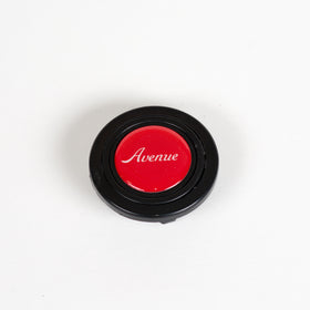 AVENUE RED LOGO HORN BUTTON W/ WHITE LETTERS