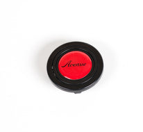 AVENUE RED LOGO HORN BUTTON W/ BLACK LETTERS