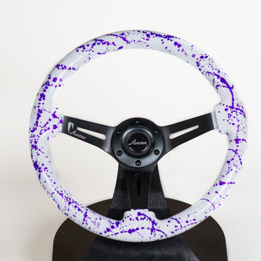 AVENUE COSMIC WHITE BASE/ PURPLE SPLATTER/ BLACK SPOKES STEERING WHEEL (LIMITED EDITION)